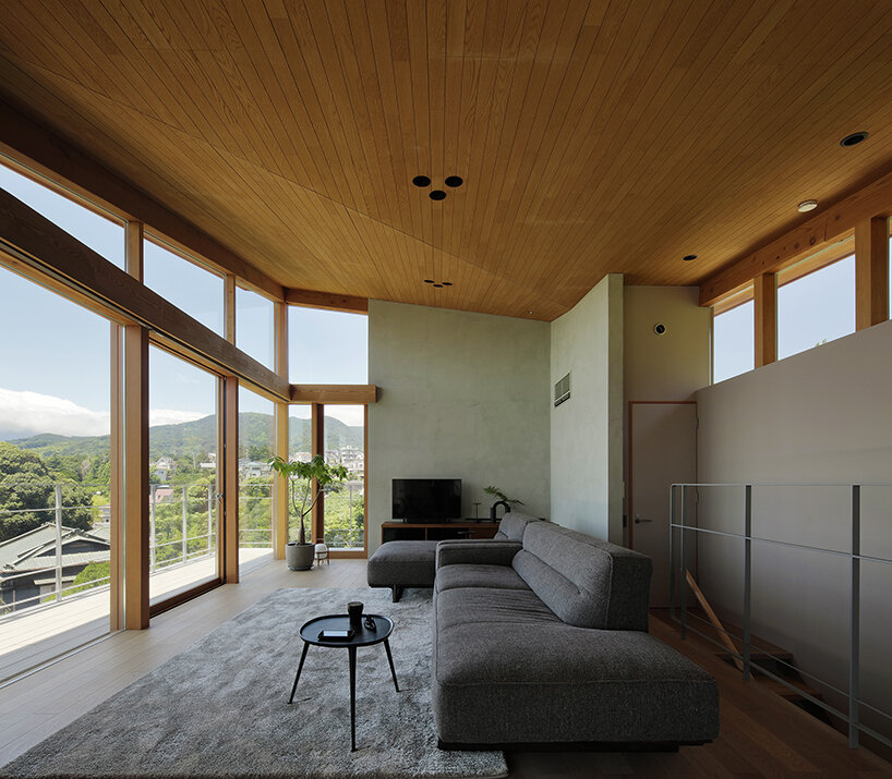 hybrid live-work spaces compose stone residence by FEDL in japanese hillside