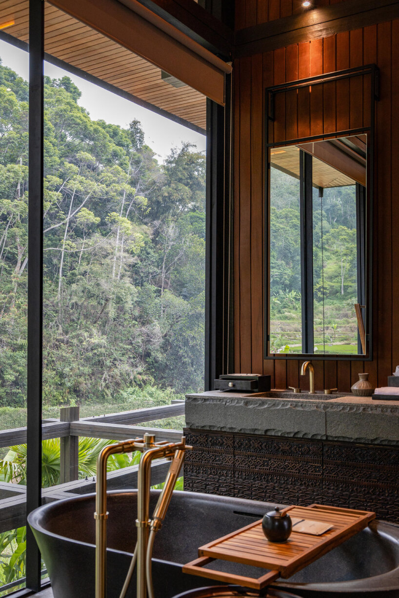 undulating wood and bamboo top k-thengono's wedding compound in indonesia countryside 