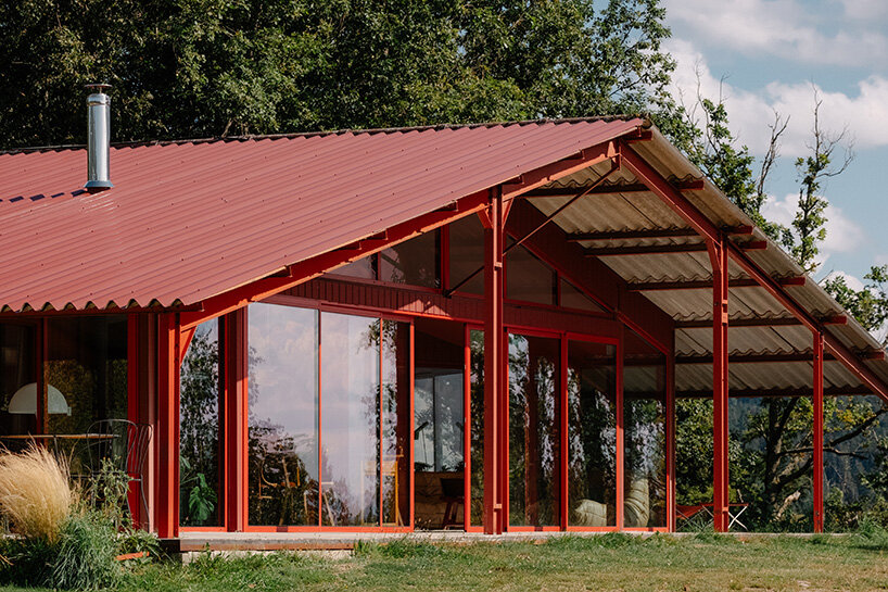 la grange rouge: dwellings cluster beneath sigurd larsen's
