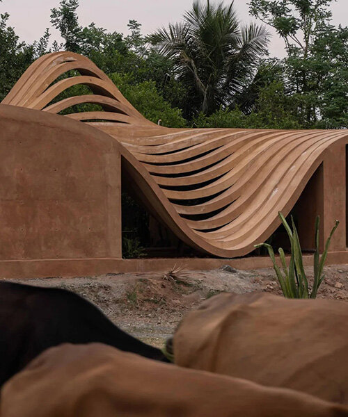 perforated curved wall acts as climatic buffer at VY architecture studio's india residence