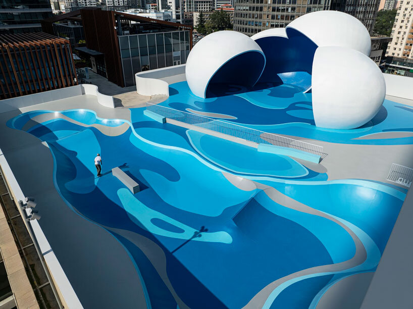 qingdao mixc rooftop skatepark's flowing curves echo ocean waves and sky