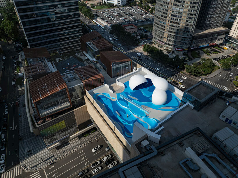 qingdao mixc rooftop skatepark's flowing curves echo ocean waves and sky