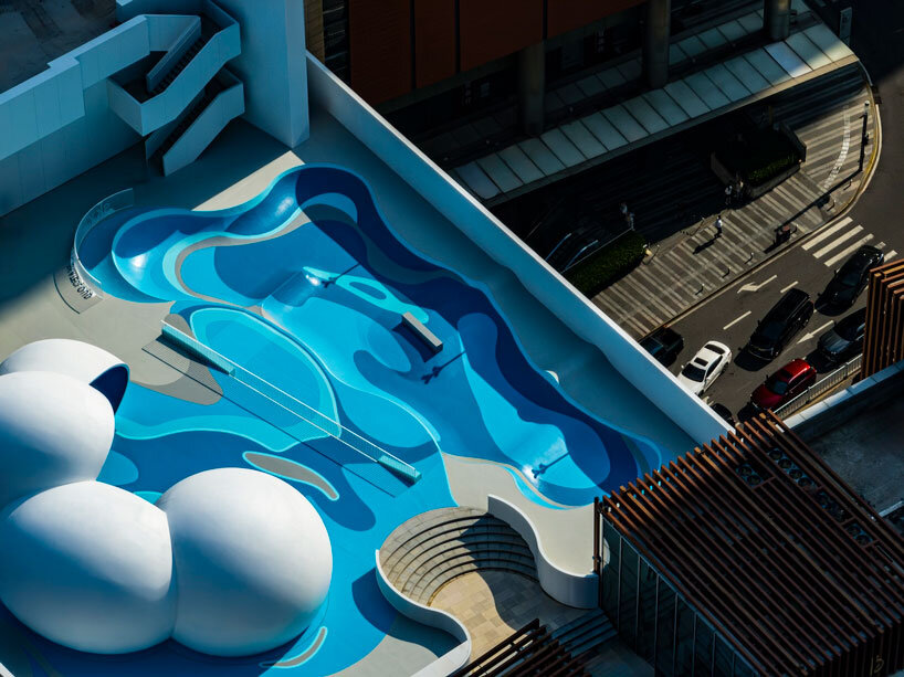 qingdao mixc rooftop skatepark's flowing curves echo ocean waves and sky