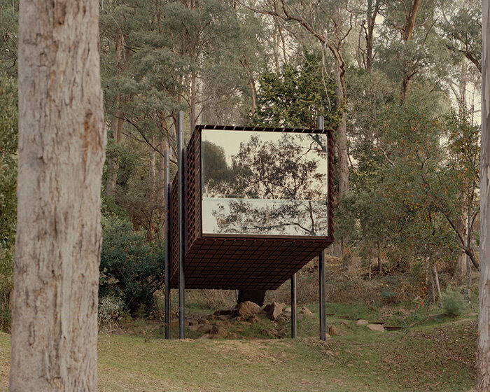 slatted steel panels filter sunlight into robbie walker's sawmill treehouse in australia