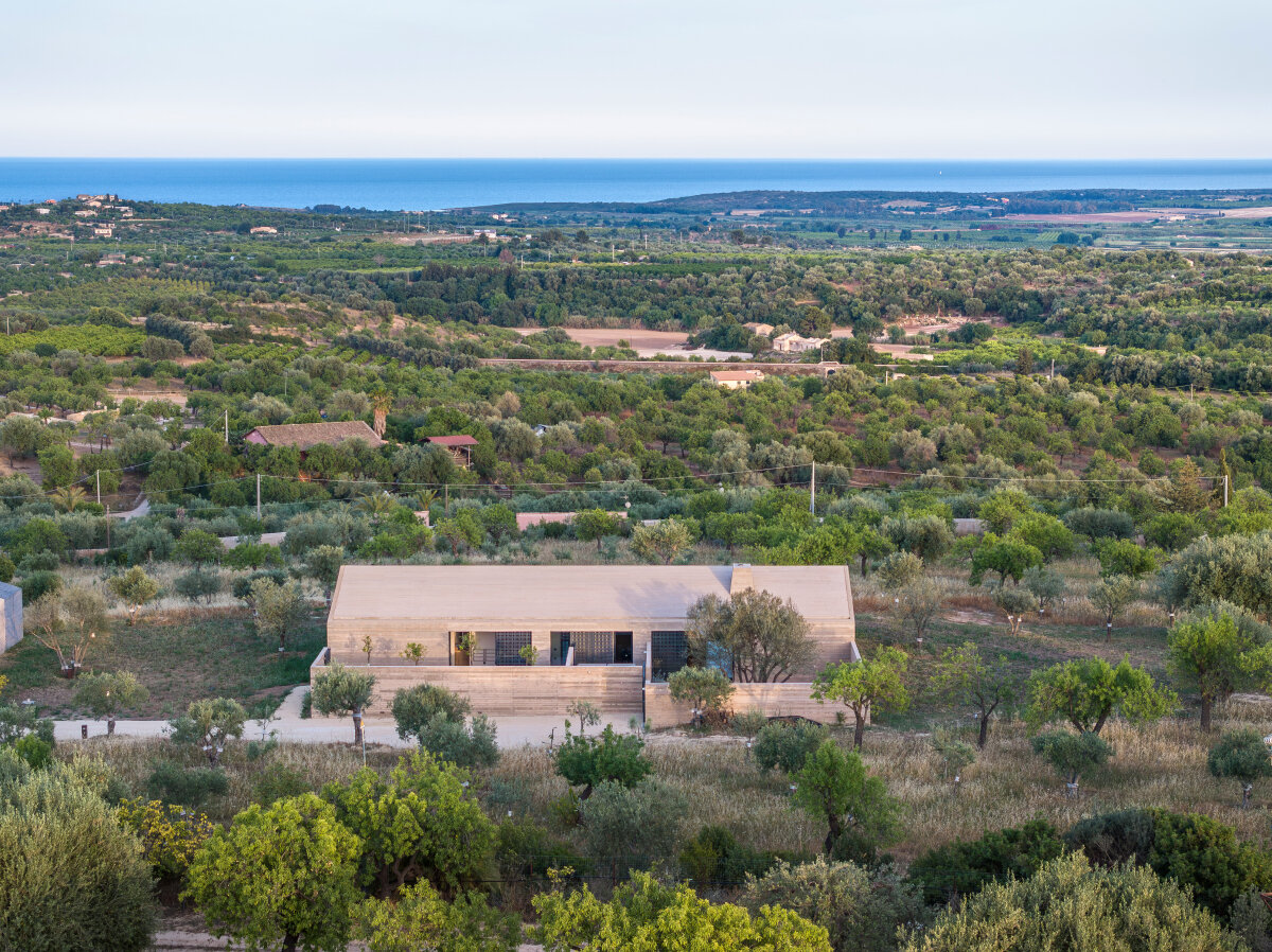 mineral textures & bioclimatic design shape gaëtan le penhuel and associates' house in sicily