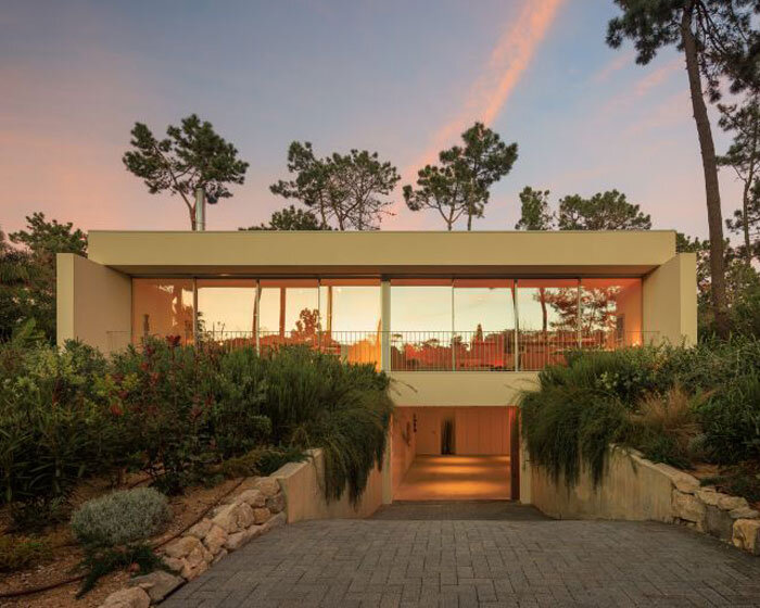 four planes coated in white stucco compose casa calma by araja studio in portugal