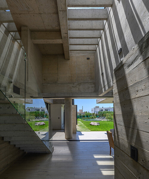 with expressive concrete structure, nnarquitectos' casa nnCLP flooded with striped shadows