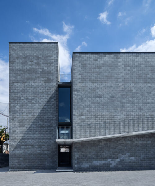 concrete blocks wrap bora architects' BLDG02 monolithic office building in japan