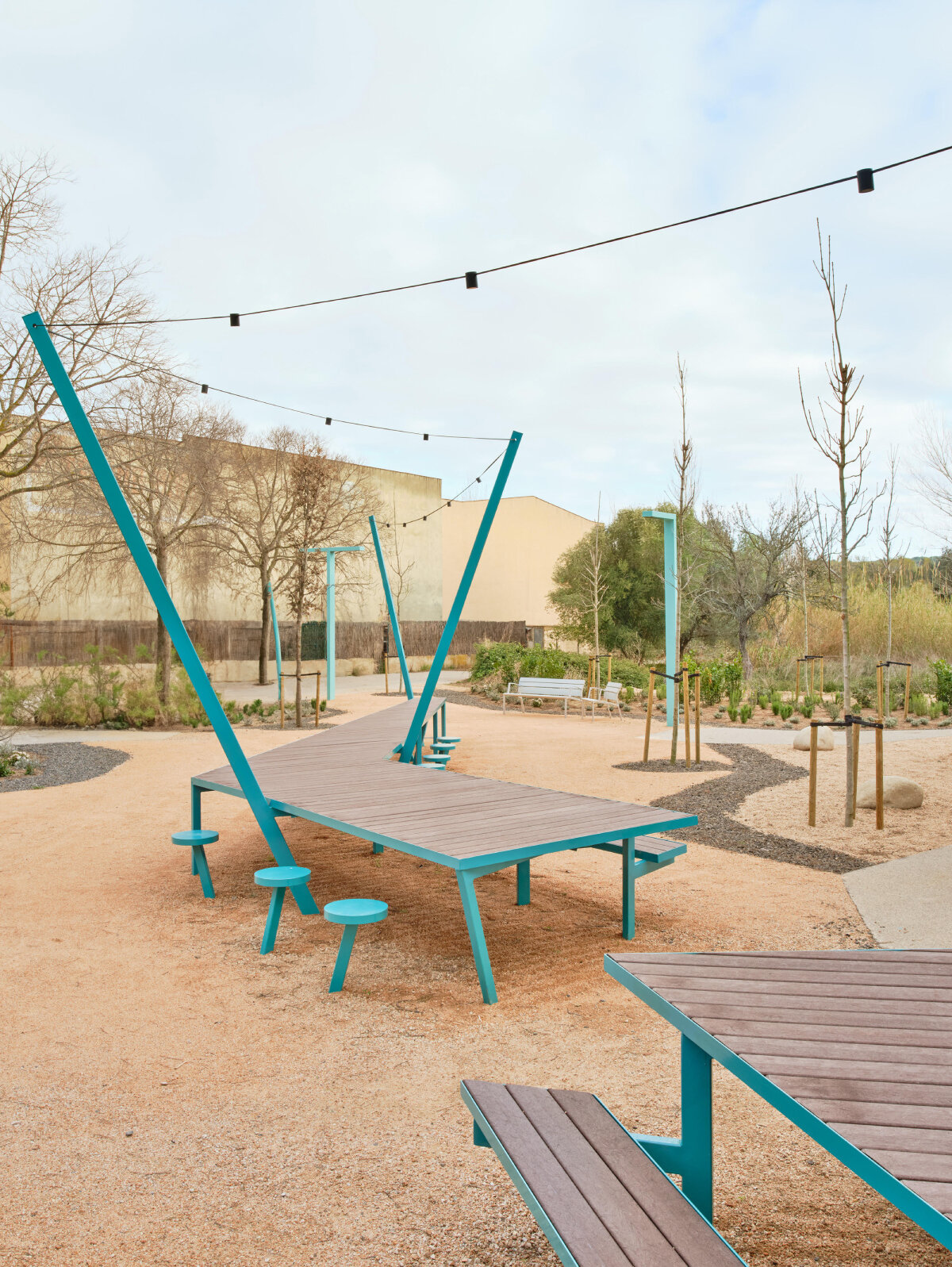 ceramic blue tiles evoking mediterranean clad h3o architects' communal barbecue in spain