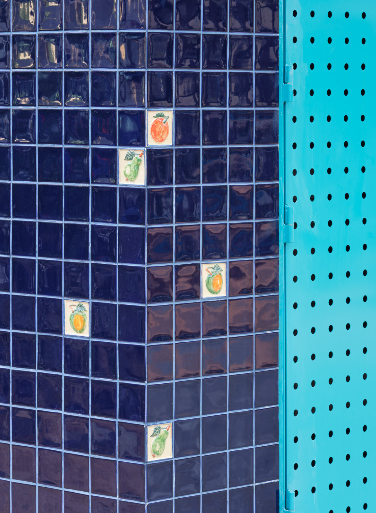 ceramic blue tiles evoking mediterranean hues clad h3o architects' public barbecue in spain