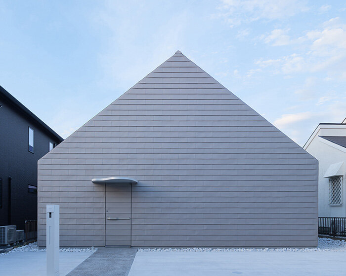 metallic steel sheets clad residence by MASA architects, reflecting the changing sky in japan