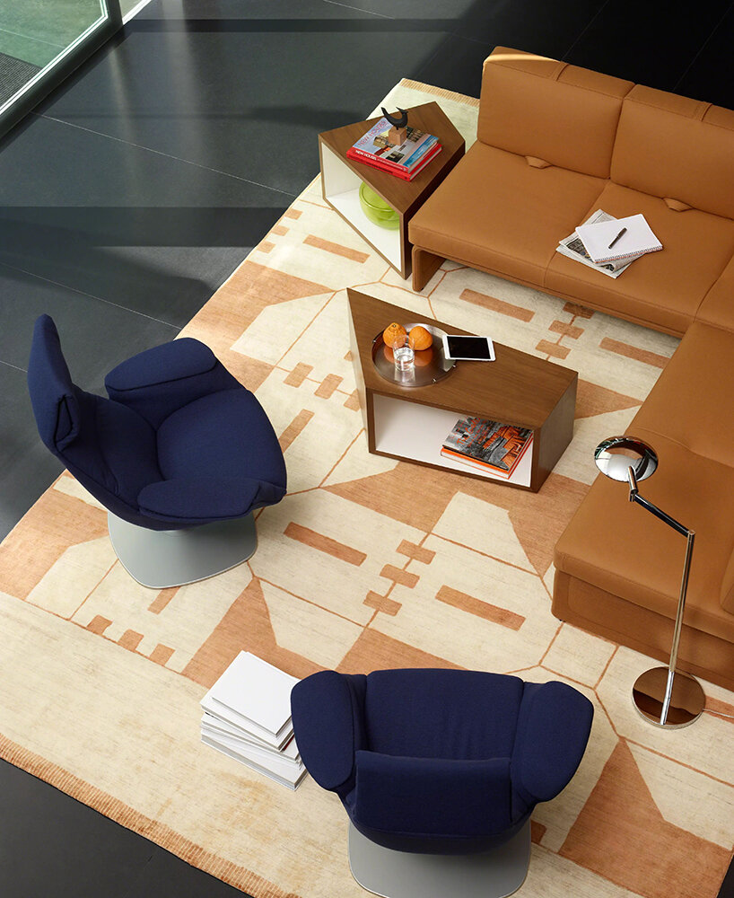 steelcase foresees future of work with cord pass-through & swivel tablet of massaud lounge