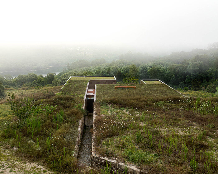 casa da levada: a low-impact home with cork facade and disguised green roof