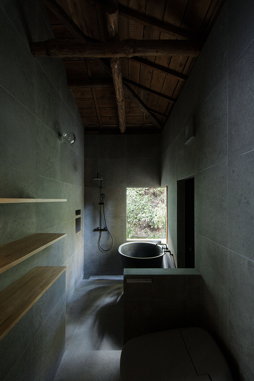 wooden atelier rises from preserved framework of 90-year-old japanese home