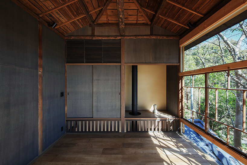 wooden atelier rises from preserved framework of 90-year-old japanese home