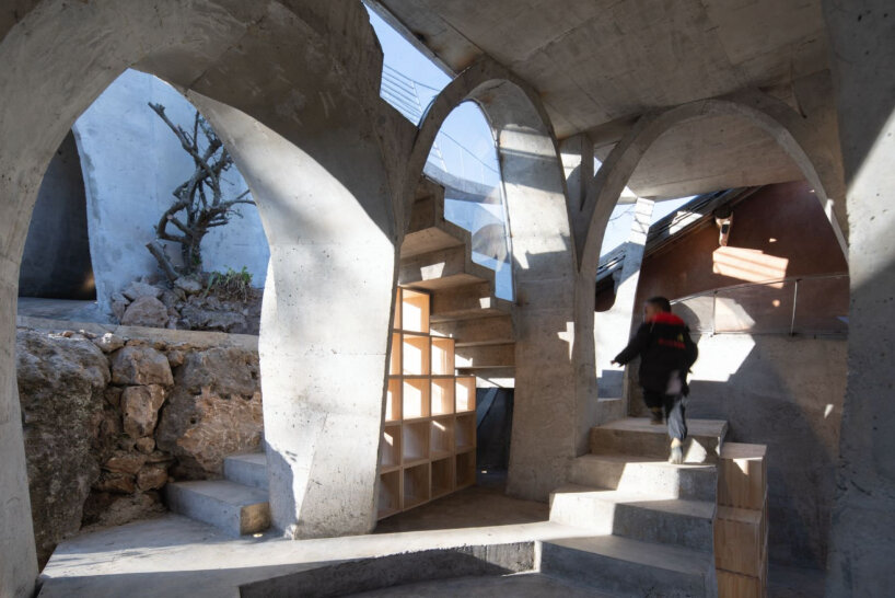 xong xiangwei studio's concrete mushroom library creates reading space for children in china