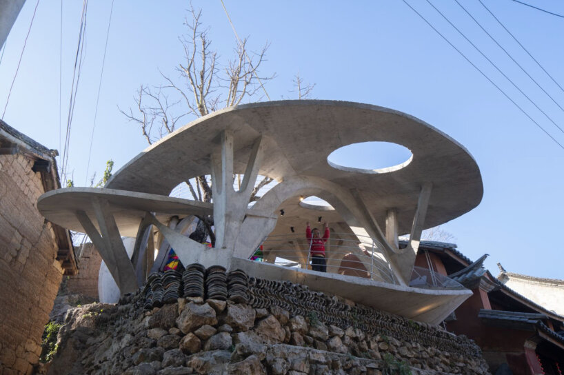 xong xiangwei studio's concrete mushroom library creates reading space for children in china