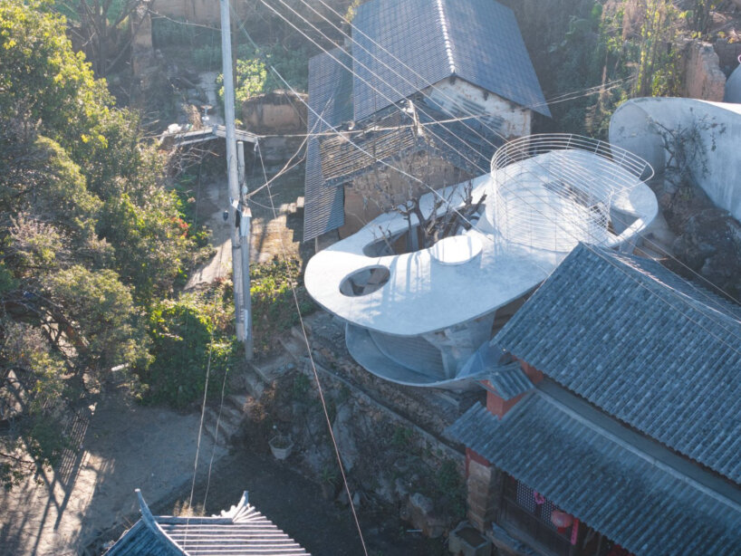 xong xiangwei studio's concrete mushroom library creates reading space for children in china