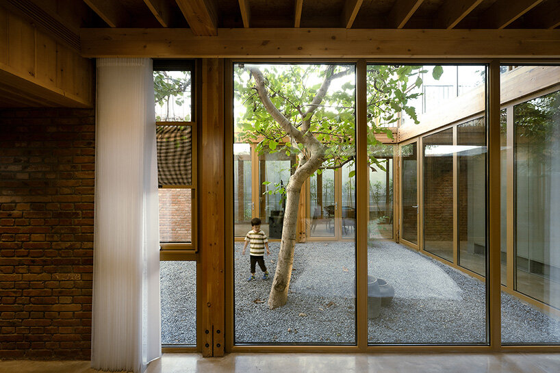 archstudio revives courtyard tradition with timber-framed guesthouse in beijing