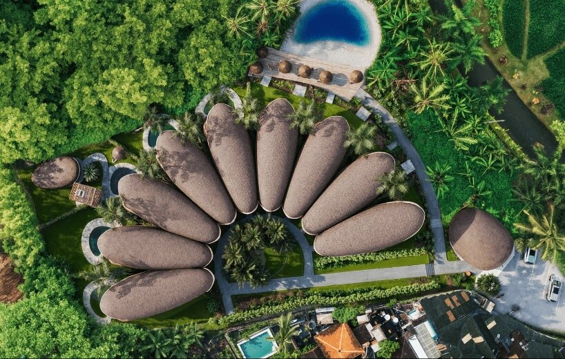 boutique hotel in bali by archigods opens like a blooming ring of pistachio shells