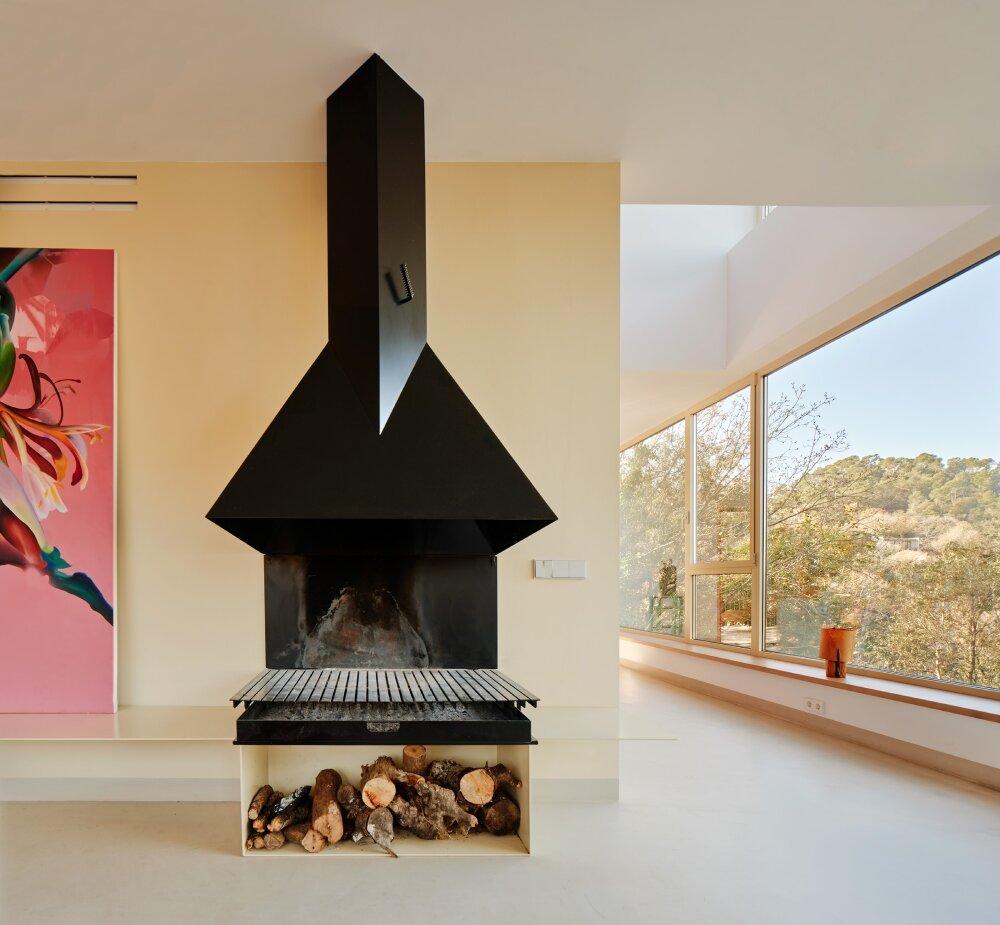 raúl sánchez's casa magarola rests above steep, sloping terrain in spain