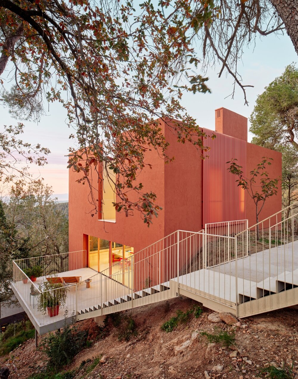 raúl sánchez's casa magarola rests above steep, sloping terrain in spain