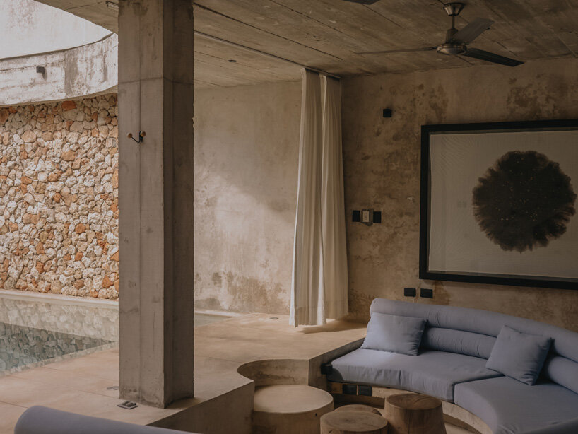mexican house by ludwig godefroy unfolds as a porous concrete shell around lush courtyards