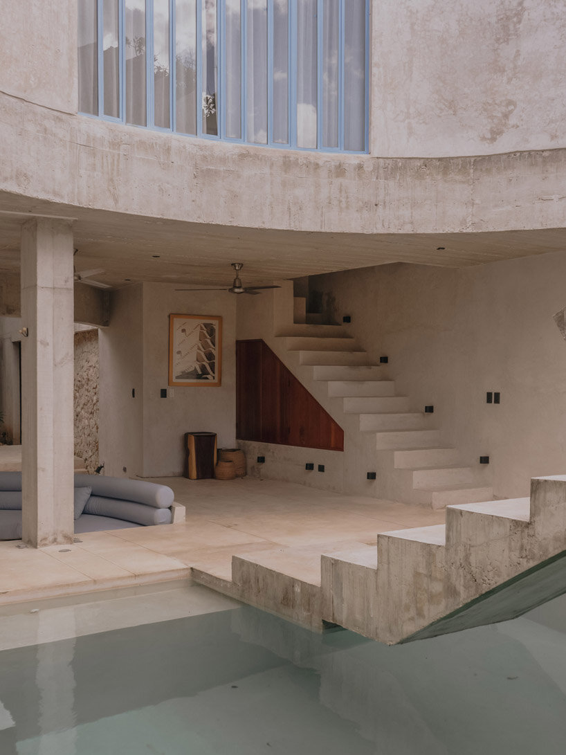 mexican house by ludwig godefroy unfolds as a porous concrete shell around lush courtyards