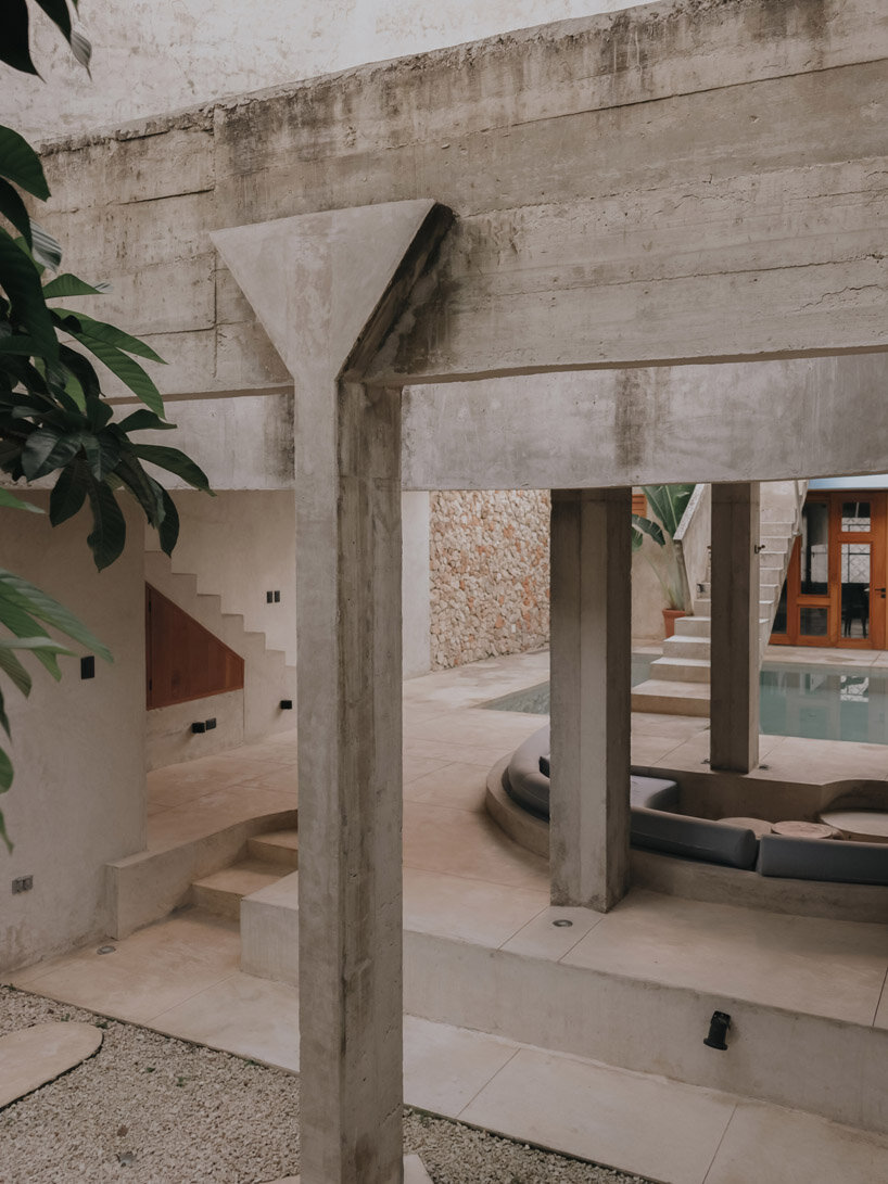 mexican house by ludwig godefroy unfolds as a porous concrete shell around lush courtyards