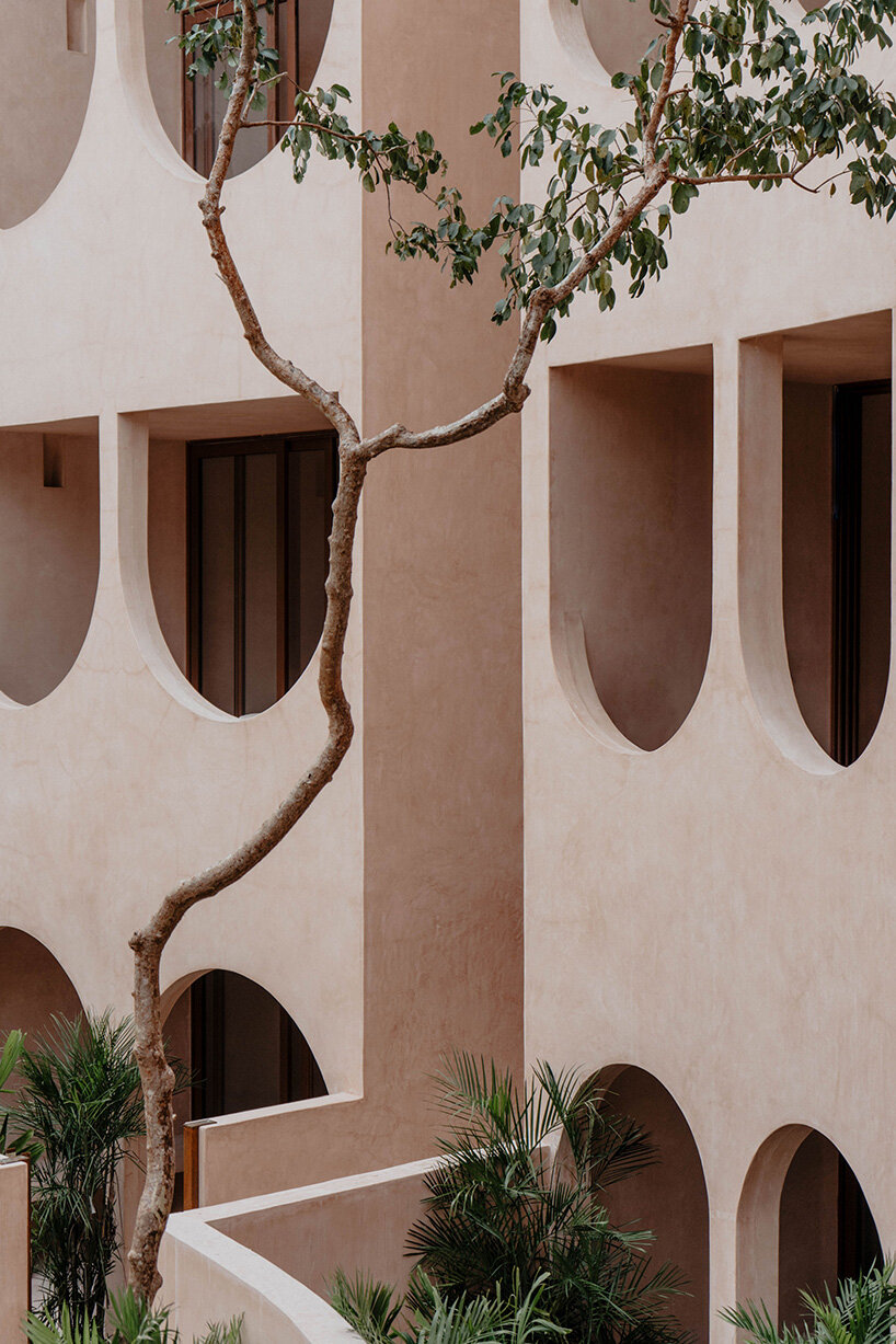 central tower rises from elliptical courtyard in V taller's arched complex in mexico