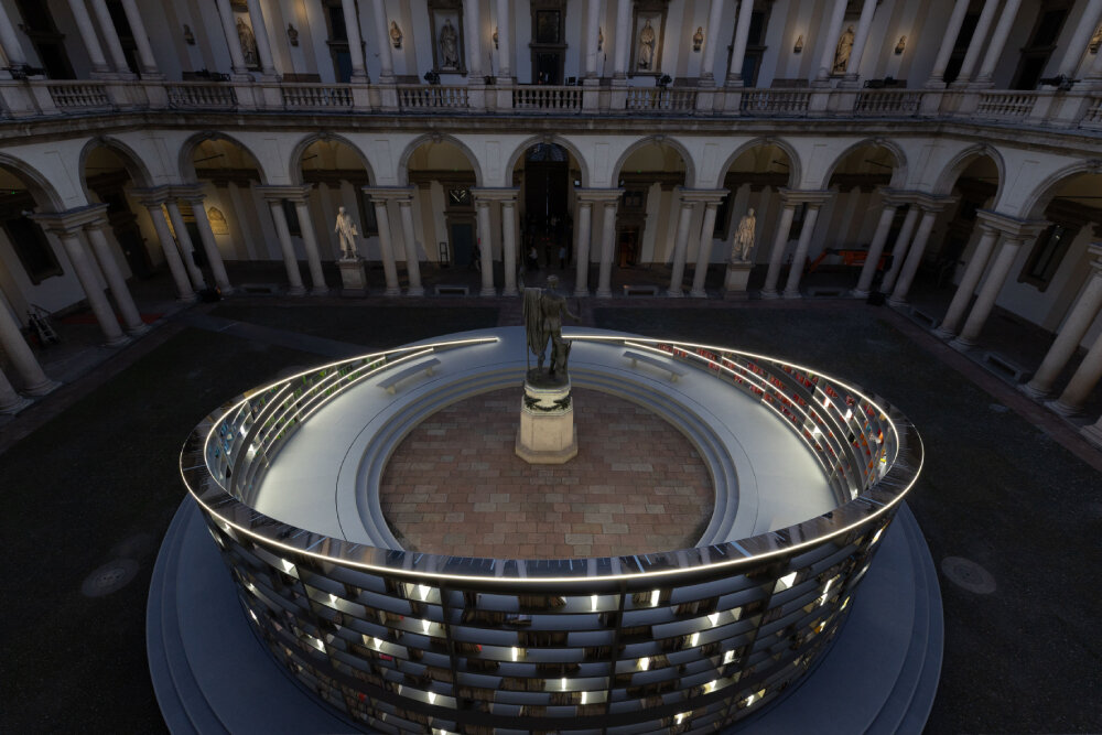 es devlin's rotating library installation illuminates historic courtyard at milan design week