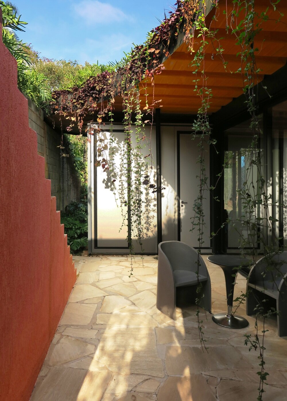 paul clemence captures perforated steel curves of rodrigo ohtake's modular house in brazil