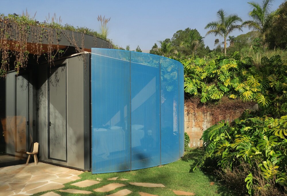 paul clemence captures perforated steel curves of rodrigo ohtake's modular house in brazil