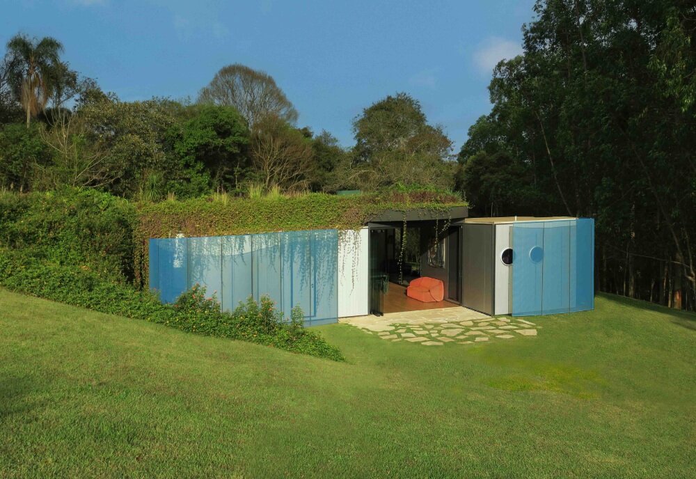 paul clemence captures perforated steel curves of rodrigo ohtake's modular house in brazil