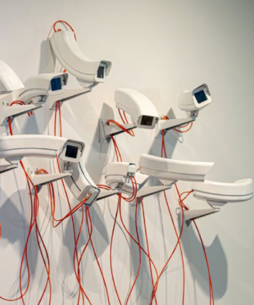 jakub geltner bends surveillance cameras into curved installations for exhibition in belgium
