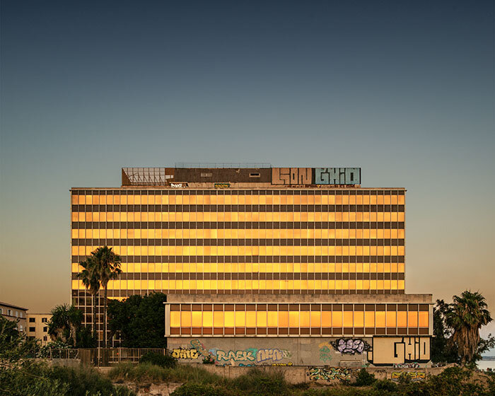 photo series by lluís bort captures mallorca's abandoned buildings under gradient blue skies