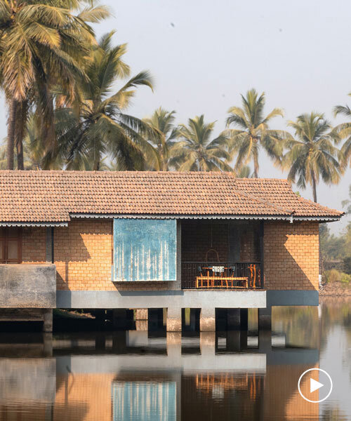 pond houses crafted from earth blocks float above land and water in india