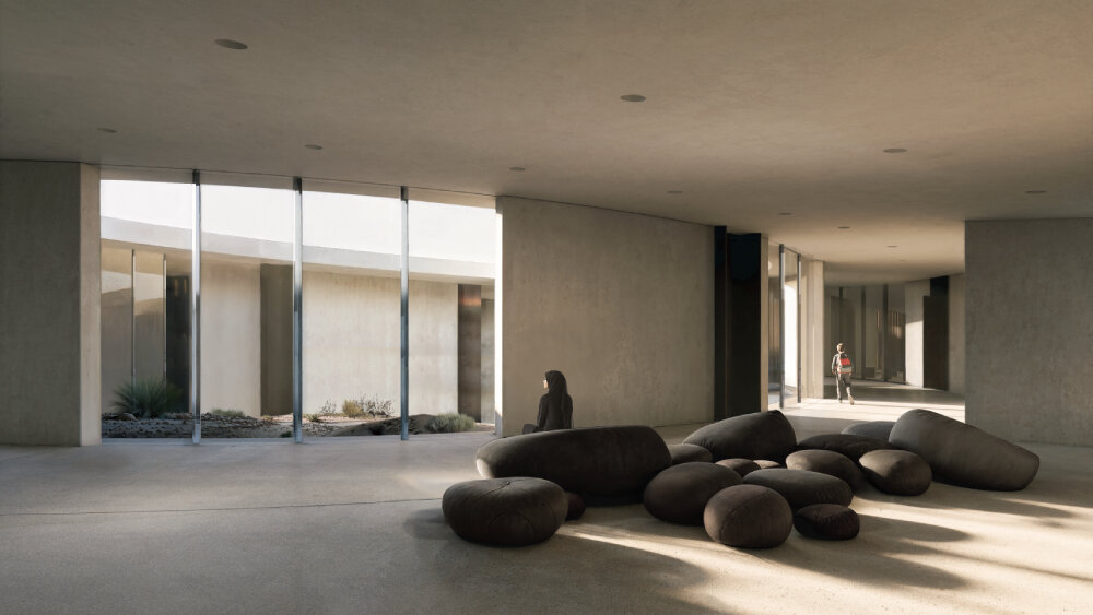 pragma carves rock art visitor's center into rugged terrain of archaeological site in UAE