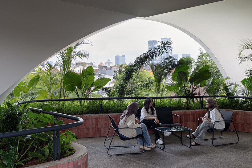 RAD+ar punctures arched facade to protect office building from jakarta's humid climate