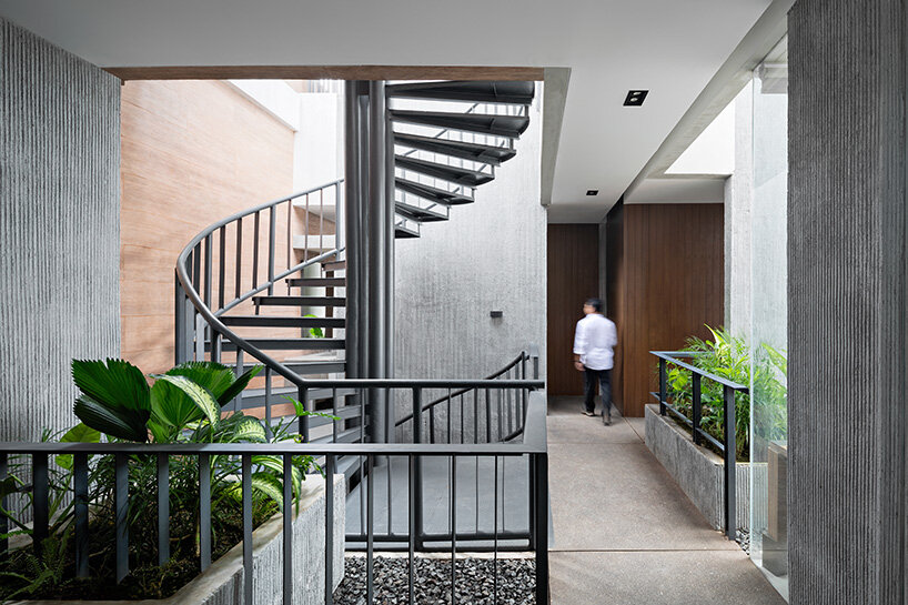 RAD+ar punctures arched facade to protect office building from jakarta's humid climate