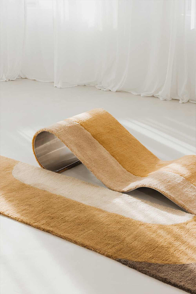 sculptural daybed emerges from gun-tufted wool rug by BUDDE and nando studio