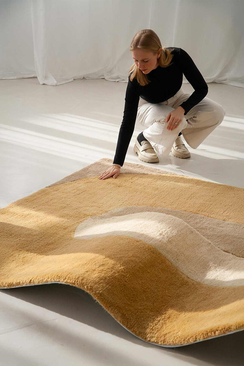 sculptural daybed emerges from gun-tufted wool rug by BUDDE and nando studio