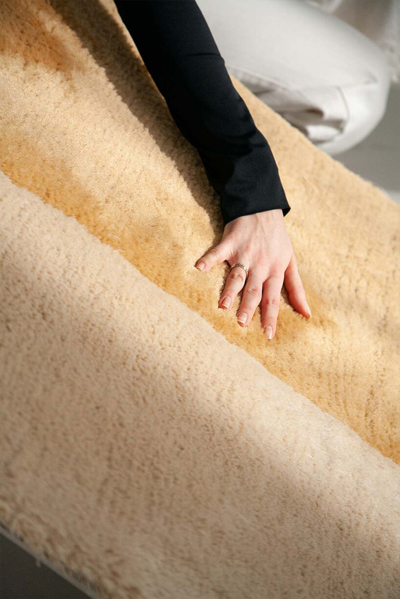 sculptural daybed emerges from gun-tufted wool rug by BUDDE and nando studio