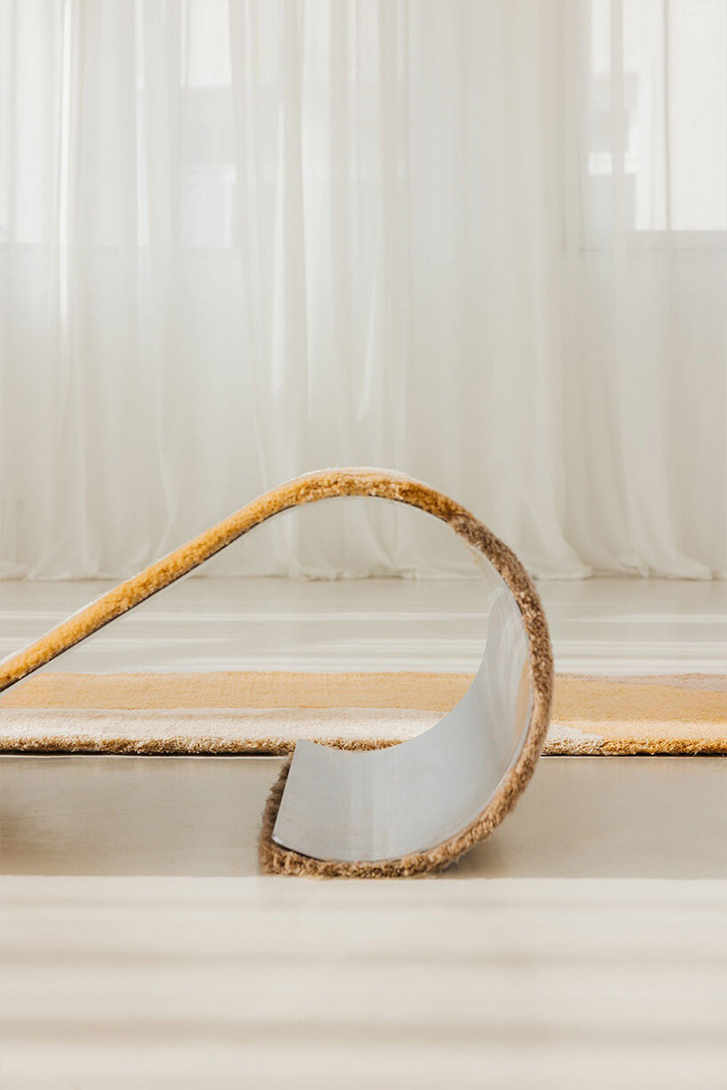 sculptural daybed emerges from gun-tufted wool rug by BUDDE and nando studio