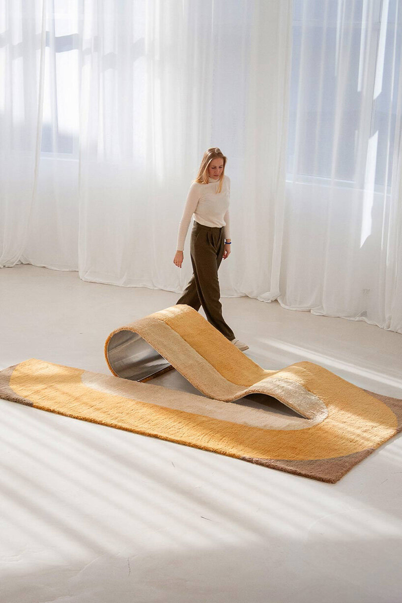 sculptural daybed emerges from gun-tufted wool rug by BUDDE and nando studio