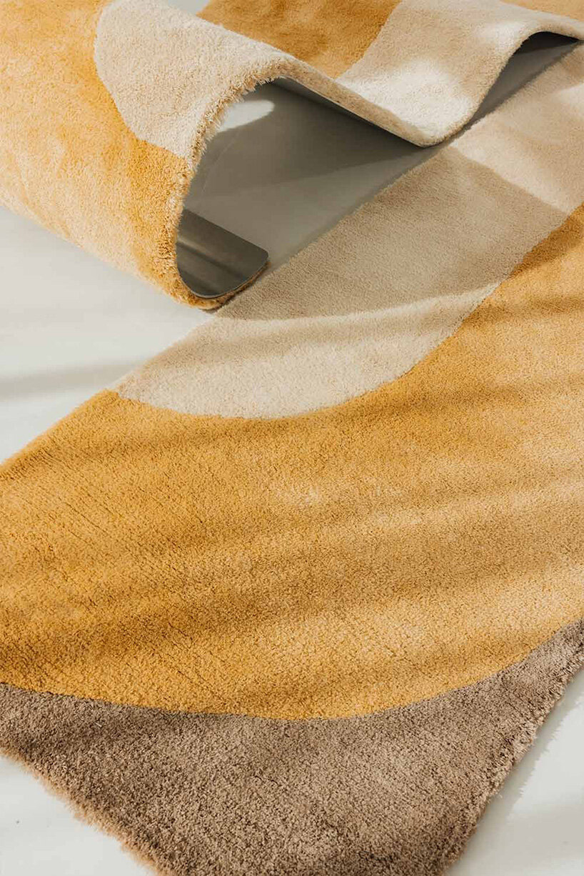 sculptural daybed emerges from gun-tufted wool rug by BUDDE and nando studio