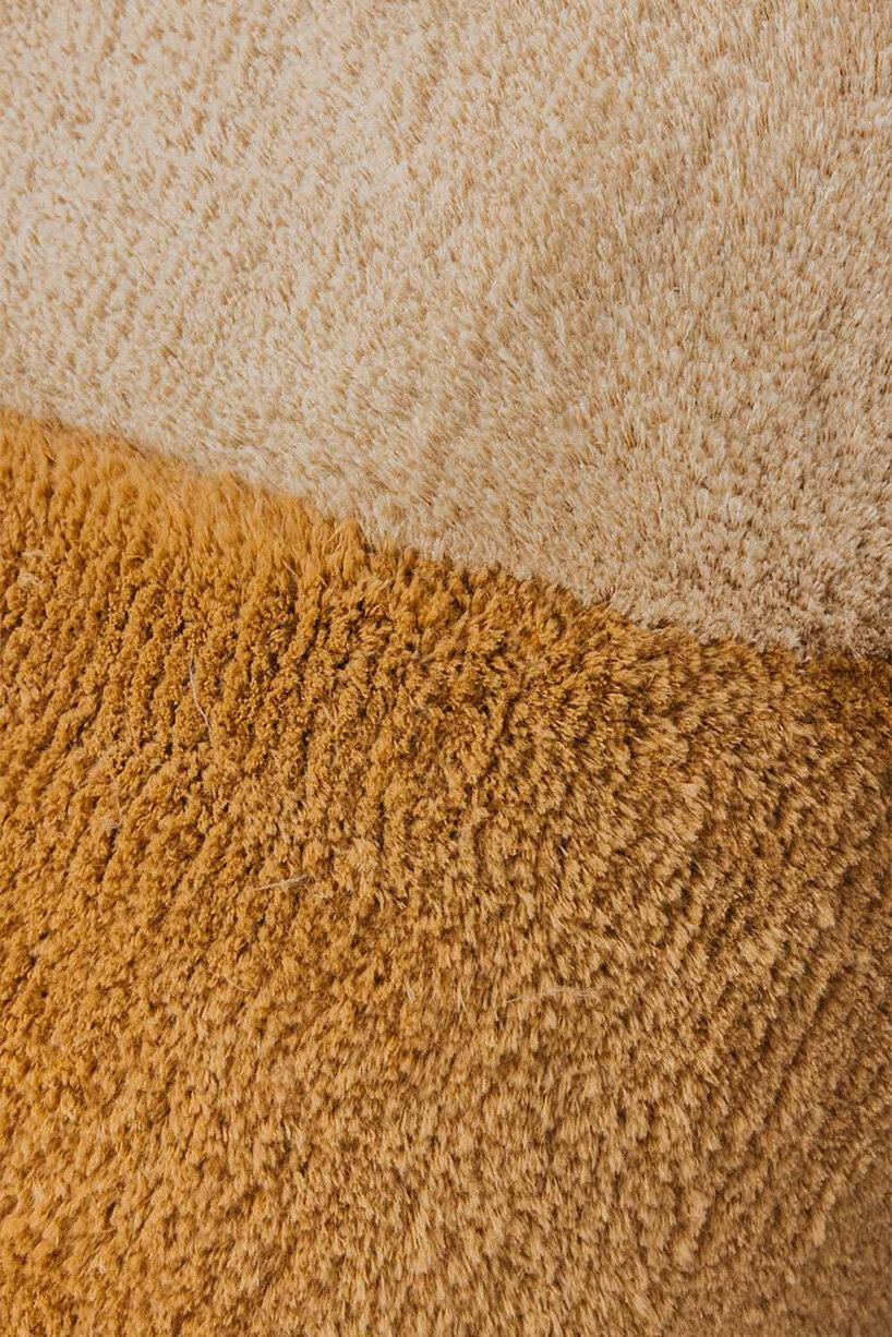 sculptural daybed emerges from gun-tufted wool rug by BUDDE and nando studio