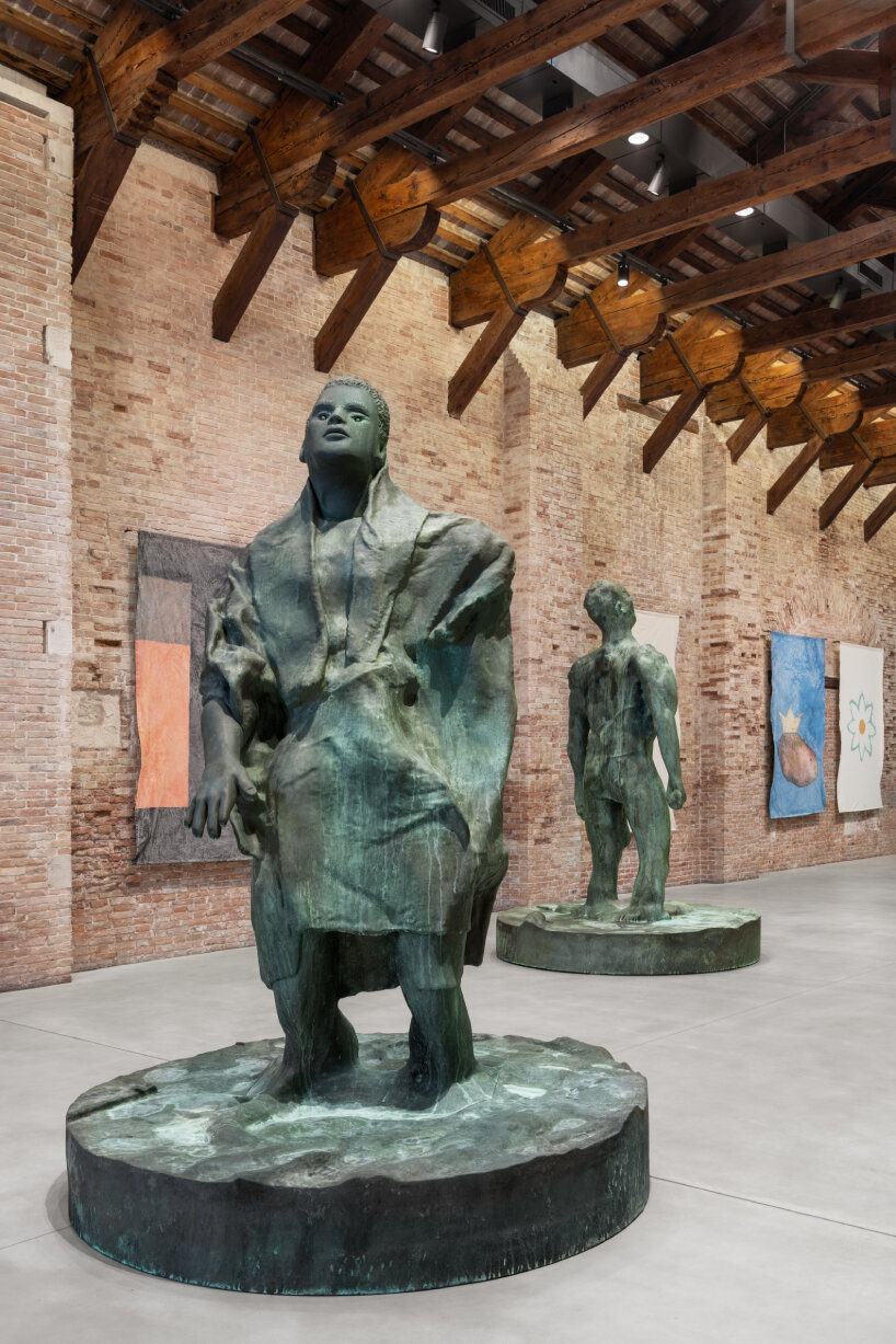 A large bronze sculpture of a male figure from Thomas Schütte's works depicting human struggle.