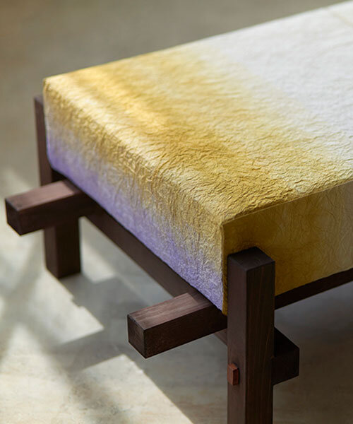 swarm dyes washi paper with hues of purple and gold for installation at milan design week