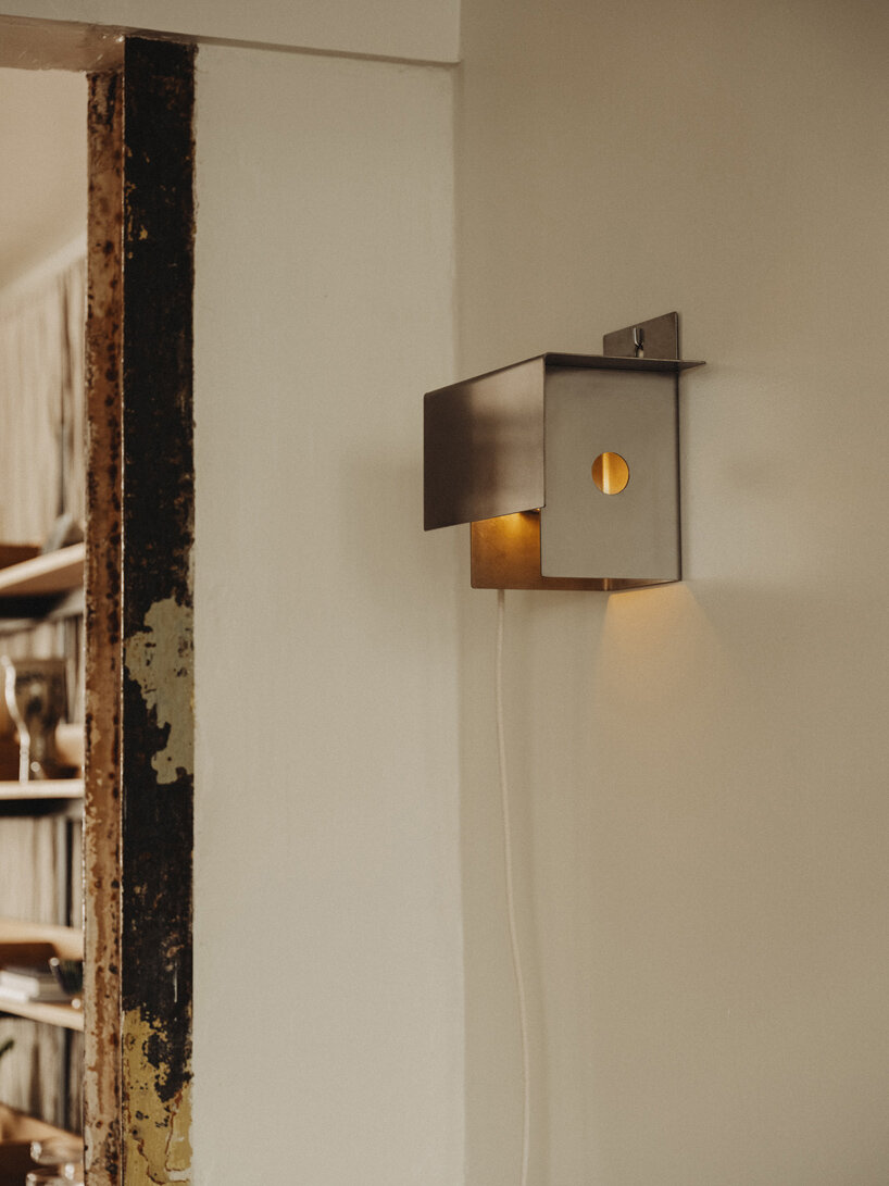 wiercinski-studio builds cozy 'amator' restaurant around modular oak table in copenhagen